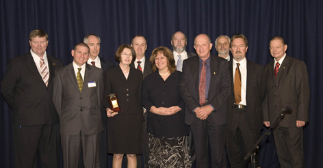 Back L-R: Paul Larcombe (Disability Action Week State Planning Committee), Ron Apelt (Qld Dept of Public Works), Stuart Grierson (Qld Dept of Public Works), John Crawford (RMIT), Paul Smith (QUT)Front L-R: Ben Klaassen (Qld Dept of Public Works), Carole Green (CRC for Construction Innovation), Debbie Smit (QUT), Dale Gilbert (Qld Dept of Public Works), Bryce Tolliday (Access Allways Consultants), Hon Warren Pitt MP (Minister for Disability Services) 